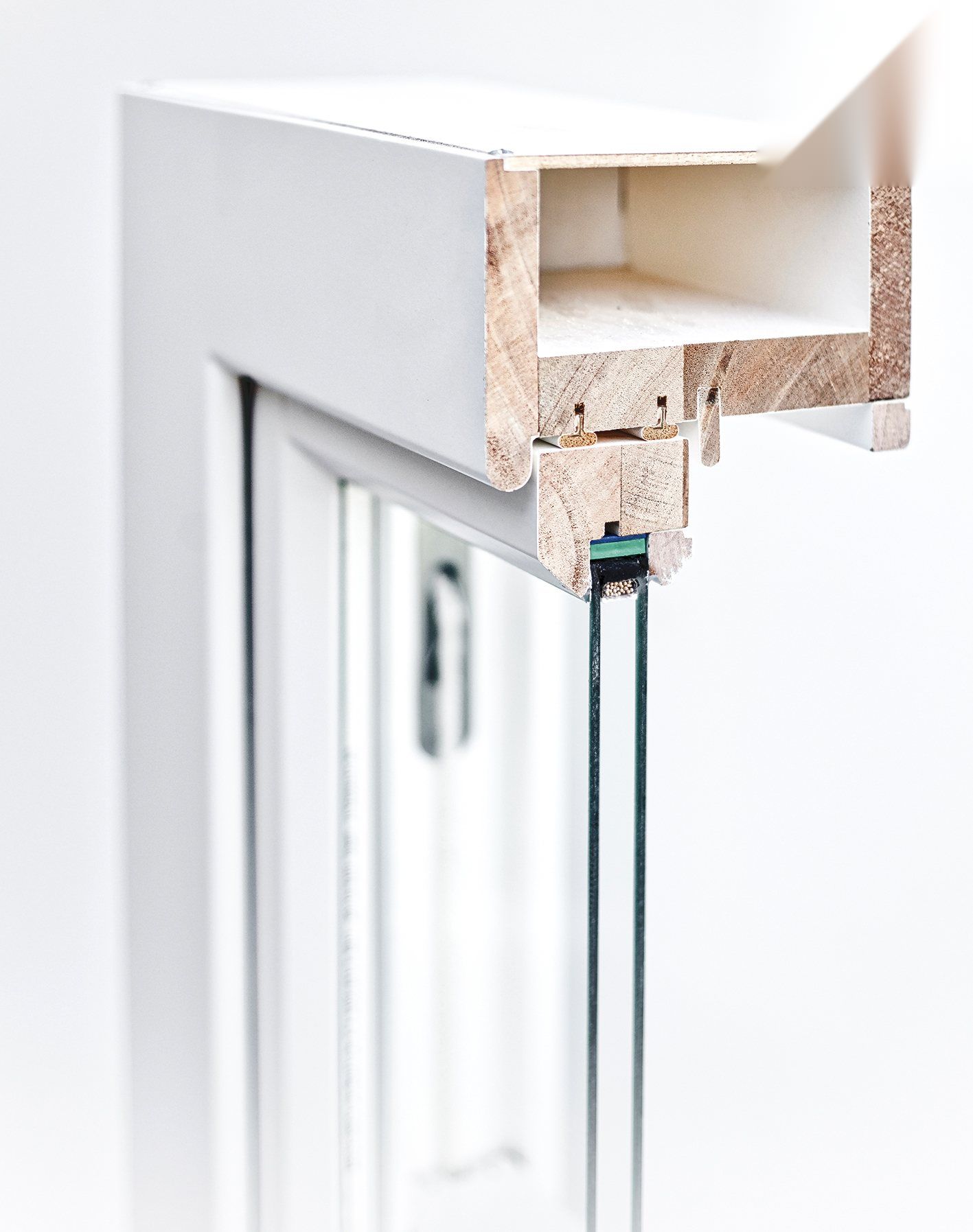 Box sash head cut through, showing solid timber and the sealed unit